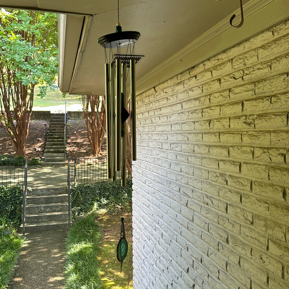 Metal windchime with cut agate centerpiece